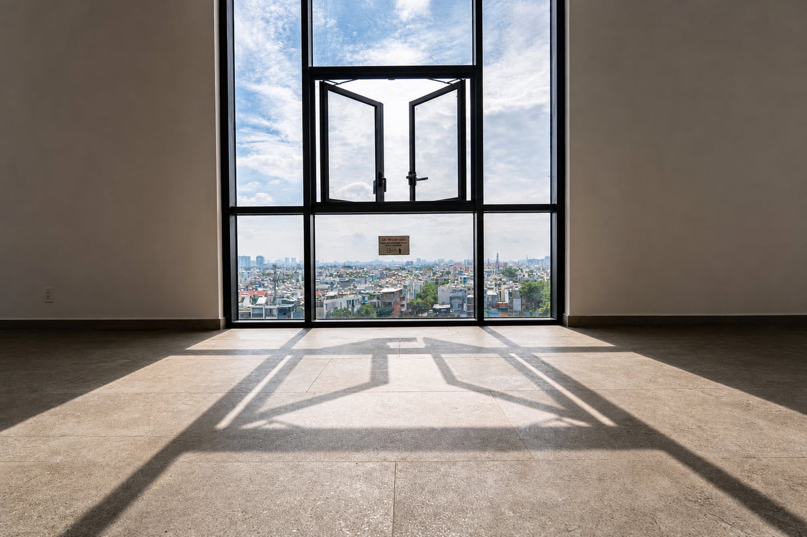 The same room brightened, walls and stone floor visible, the view outside still readable.