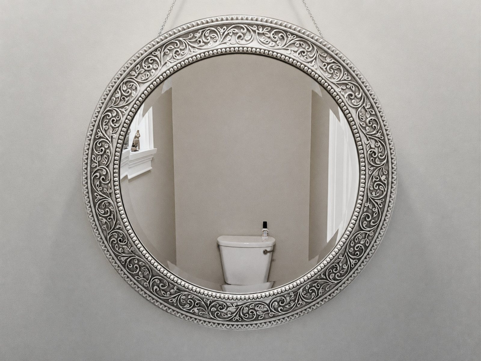 The same mirror without arm or camera, the wall reflected in their place, window sill and cistern remain, the picture has a slightly warm tint.