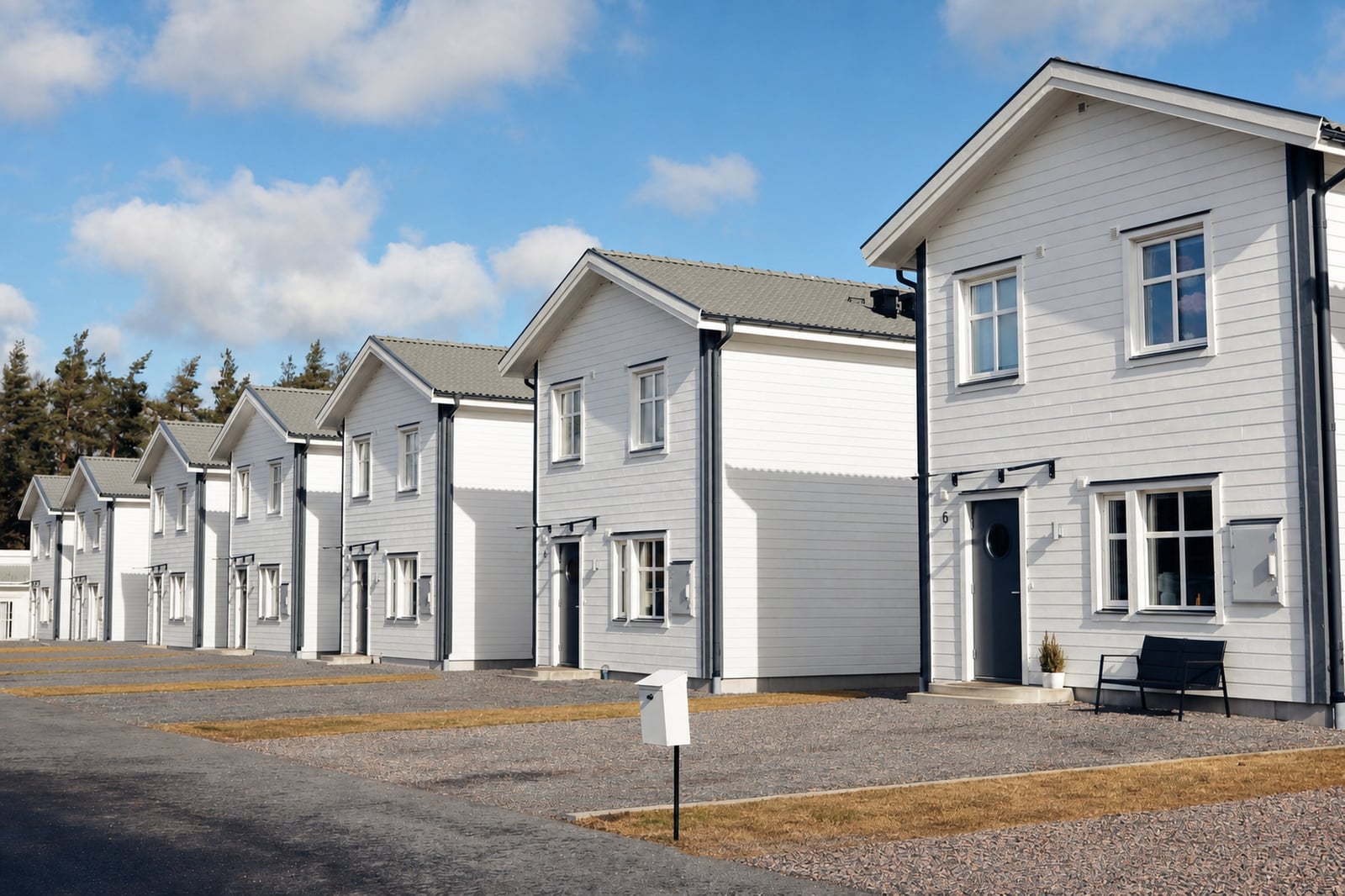 The same row of houses without bins or car, the drive clear.